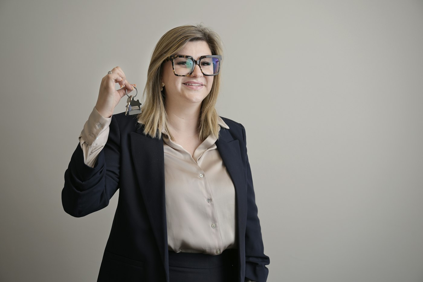 A real estate agent holding house keys